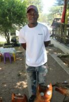 Sculptor Sydney Chesa shows off his contribution to the Spring market.