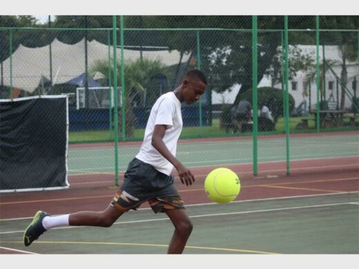 Siphesihle Ngwenya kicks the ball during the game. Photo: Duduzile Khumalo