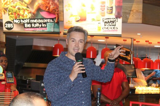 Chief Marketing Officer of Nando’s Doug Place speaks at the reopening. Photo: Duduzile Khumalo