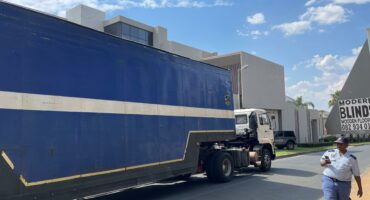 Two big trucks fetch the assests siezed from Hangwani Maumela’s home. The Lamborghini’s have been taken. Photo: Xoliswa Zakwe