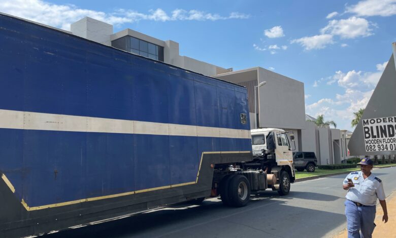 Two big trucks fetch the assests siezed from Hangwani Maumela’s home. The Lamborghini’s have been taken. Photo: Xoliswa Zakwe