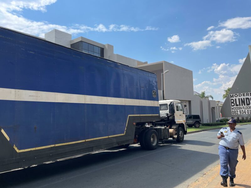Two big trucks fetch the assests siezed from Hangwani Maumela’s home. The Lamborghini’s have been taken. Photo: Xoliswa Zakwe