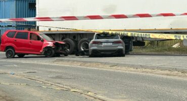 A red minibus taxi and an Audi are two of the multiple vehicles damaged in the shooting on October 30, 2025. Photo: Itumeleng Maloka