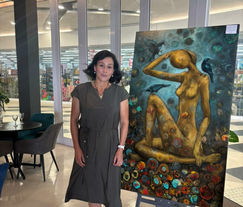 Natalie Hodgson may be soft-spoken, but she’s fearless on canvas, bringing bold colour, layered texture, and personal transformation to the Rooted in Connection exhibition at Morning Glen Mall.