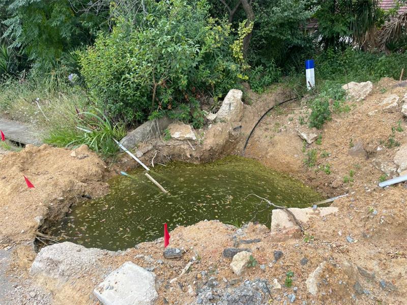 Residents say delays and poor repairs have turned a simple pipe fix into a major road hazard.