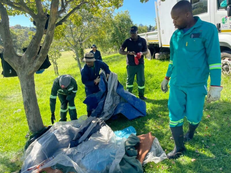 City of Johannesburg municipal departments sweep through George Lea Park South in Parkmore, removing squatters’ belongings and tackling illegal dumping during a high-impact operation.