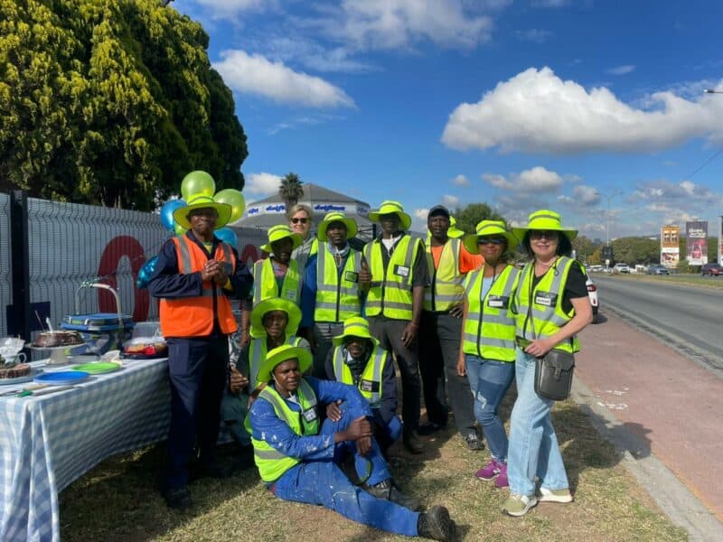 The community-driven non-profit organisation marked one year of service with a street clean-up and cake cutting ceremony.