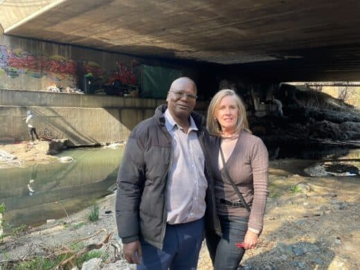 Black Tree Security's Thembani Mncube and Sandown resident Jill Hagley call on city authorities to address illegal occupation at the Katherine Street Bridge and inspect the bridge's structural integrity. Photo: Xoliswa Zakwe