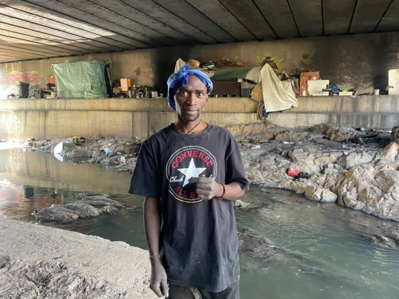 Residents are urging city authorities to intervene at the Katherine Street bridge, warning that people living under the structure face life-threatening flood risks.