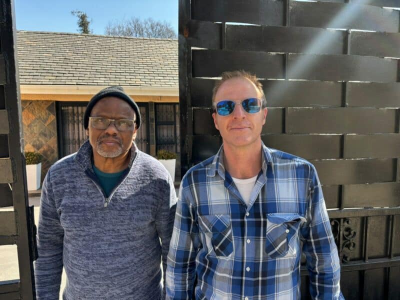 Sam Tau and Andrew Stewart speak about the power issue in Bramley North July 21, 2026. Photo: Duduzile Khumalo