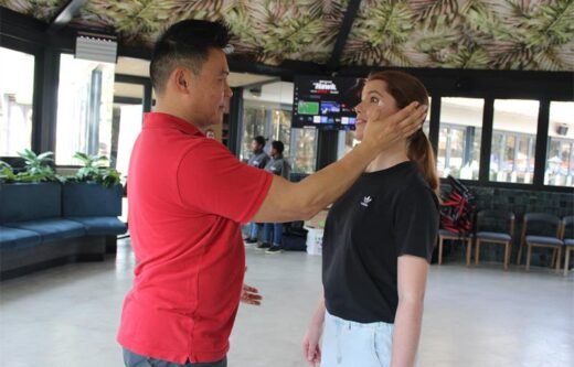 Warren Ho and Gabriella Müller demonstrate the right spot to hit during an attack at the Women’s Day self-defence workshop in Bryanston on August 9, 2026. Photo: Xoliswa Zakwe