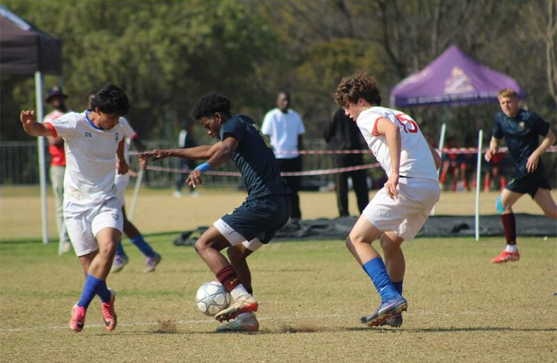 St Benedict’s Nathan Ross and Cristiano Correia with St John’s Kwandi Ngcobo battle for possession in the U19 finals of the St Davids Challenge Cup on August 9, 2026. Photo: Xoliswa Zakwe