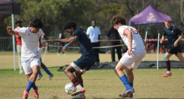 St Benedict’s Nathan Ross and Cristiano Correia with St John’s Kwandi Ngcobo battle for possession in the U19 finals of the St Davids Challenge Cup on August 9, 2026. Photo: Xoliswa Zakwe