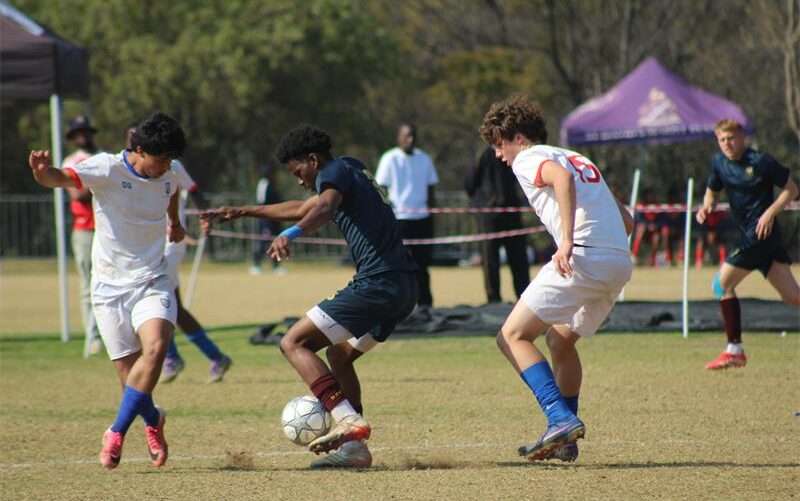 St Benedict’s Nathan Ross and Cristiano Correia with St John’s Kwandi Ngcobo battle for possession in the U19 finals of the St Davids Challenge Cup on August 9, 2026. Photo: Xoliswa Zakwe
