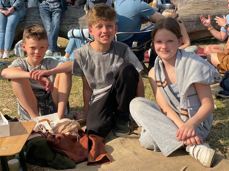 Troy Crain, Taric Bester, and Amber Crain enjoy themselves at the August edition of the Field Market in Parkmore on August 8, 2026.