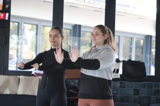 Kassandra Kokolis and Raine Dobson take part in a practical self-defence exercise during the Women’s Day Self-Defence Workshop in Bryanston on August 9, 2026. Photo: Xoliswa Zakwe