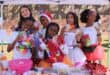 Learners dressed in colourful outfits pose behind their stall while selling drinks, sweets and other treats to fellow learners and teachers at the school’s annual Tickey Day on August 21, 2026.