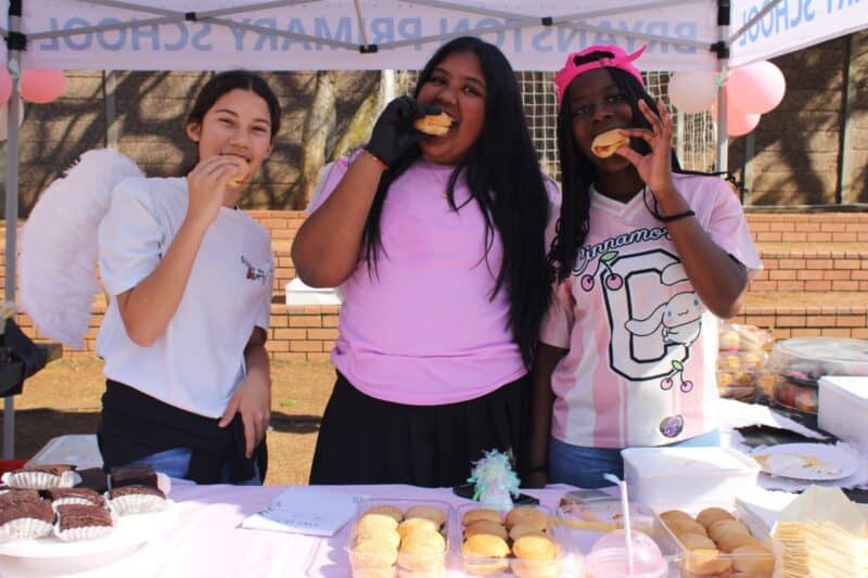 Micah Bailey, Arabhya Bahgoo and Kayla Dzirekwa enjoy some of their own treats during Bryanston Primary School’s annual Tickey Day on August 21, 2026.