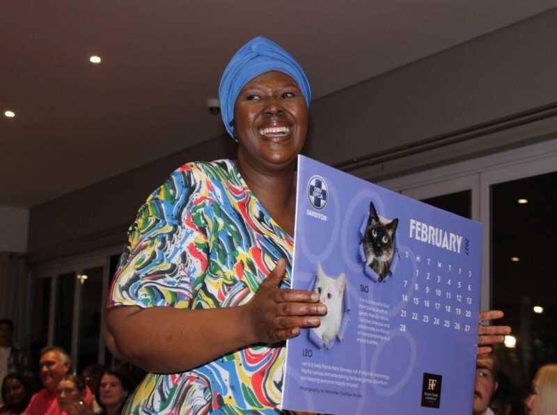 Lizzy Nkuna takes to the red carpet with the February 2027 page of the Sandton SPCA’s 2027 calendar featuring Leo and Tau during the launch at Bryanston Country Club on August 27, 2026.