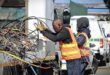 A City Power worker carefully handles a tangled mass of cables during the operation on August 13, 2026. Photo: Itumeleng Maloka