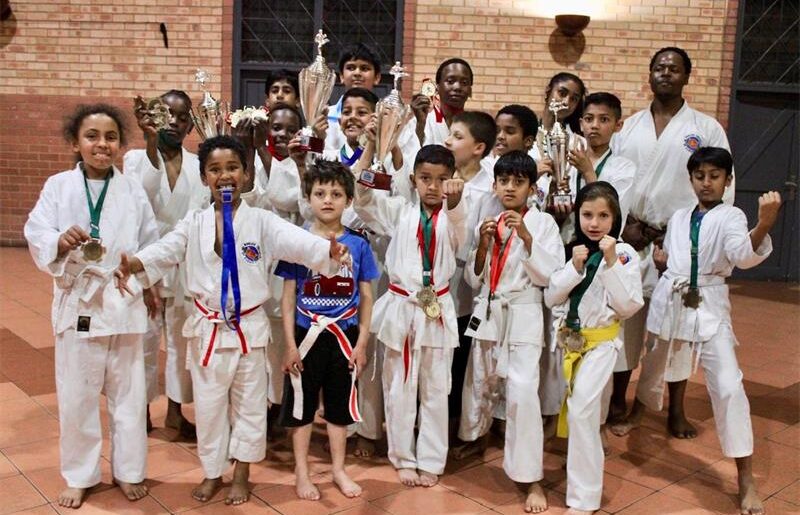 Members of the Marlboro Shotokan Karate Club proudly display their medals and trophies after delivering strong performances at the 5th Gold Karate Tournament. Photo: Xoliswa Zakwe