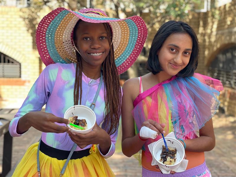 Zanesipho Nasingo and Aarna Sutram Rai having pancakes during Curro Rivonia's Grade 7 Entrepreneurship Day on August 28, 2026.