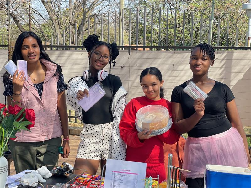 Aryana Naido, Lathithaa Siwendu, Chezney Thring and Asnath Sangwa showcase their selection of treats and products while putting their sales, marketing and teamwork skills into practice during the Curro Rivonia Grade 7 E