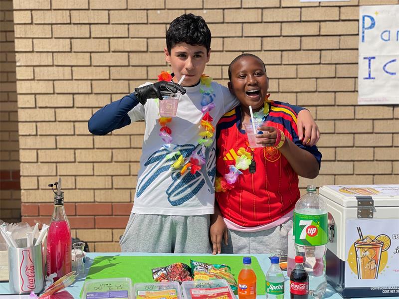 Sebastian Butler and Hlabirwa Magagane sip mocktails during Curro Rivonia's Grade 7 Entrepreneurship Day on August 28, 2026.