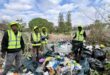 Simo Ngqulunga, Michael Nku, Mike Ncube and Sthandile Daluka work through overgrown vegetation and litter as part of an effort to restore the popular dog-walking area and improve the condition of the natu