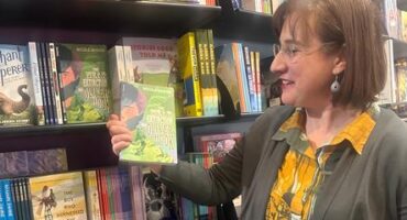 Nicole Mason holds her debut children’s book; The Near Extinction of Oliver Hook at Exclusive Books in Sandton City. Photo: Supplied