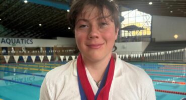 Drew poses poolside wearing the medals he won at the Eastern Gauteng Aquatics Senior Winter Championships on 22 and 23 August 2026. Photo: Supplied