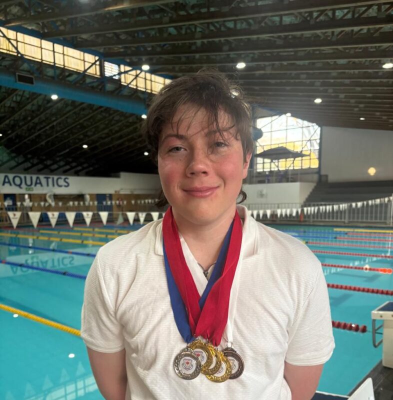 Drew poses poolside wearing the medals he won at the Eastern Gauteng Aquatics Senior Winter Championships on 22 and 23 August 2026. Photo: Supplied