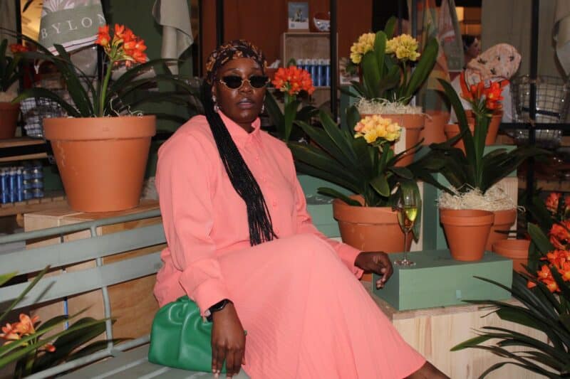 Nkosi poses among the colourful clivias and lush garden-inspired displays at the seasonal activation held at Hyde Park Corner on September 1, 2026.