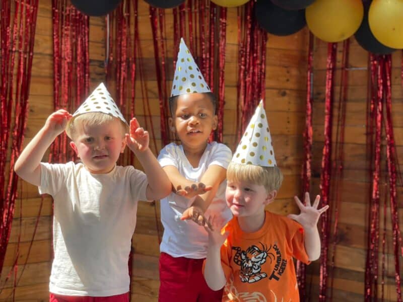 De-wet Botha, Thabo Phakisa and Cayden Van Greunen celebrate the school’s 10th birthday wearing party hats as they enjoy the day’s activities and entertainment on September 11, 2026.