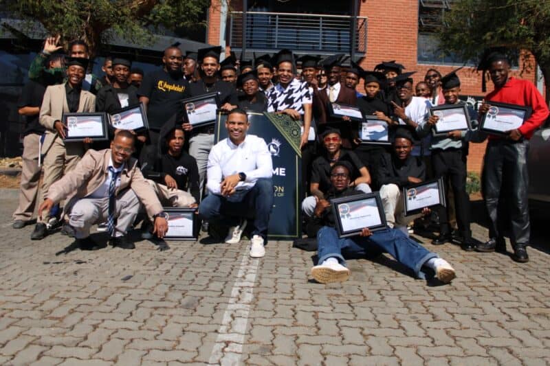 Members of the Legends Barber Training and Development Academy's 2026 graduating class pose with their certificates alongside founder Sheldon Tatchell. Photo: Nkazimulo Ncube