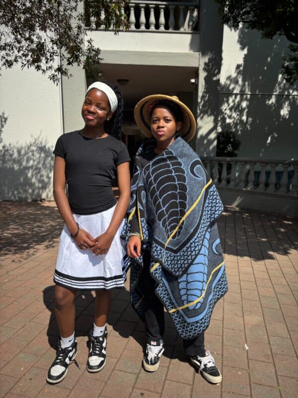 Isabella Manyi and Shera Nakedi Mahlatsi proudly showcase their colourful Heritage Day outfits during the school’s special celebration on September 23, 2026. Photo: Duduzile Khumalo