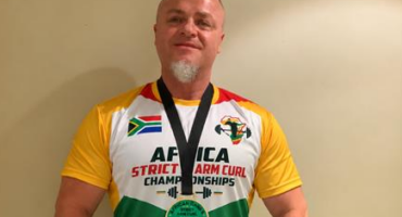 Description: Gary Katzen shows off his medals after winning the Strict Arm Curl and Freestanding Curl titles on October 9, 2026. Photo: Duduzile Khumalo