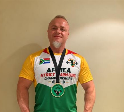 Description: Gary Katzen shows off his medals after winning the Strict Arm Curl and Freestanding Curl titles on October 9, 2026. Photo: Duduzile Khumalo