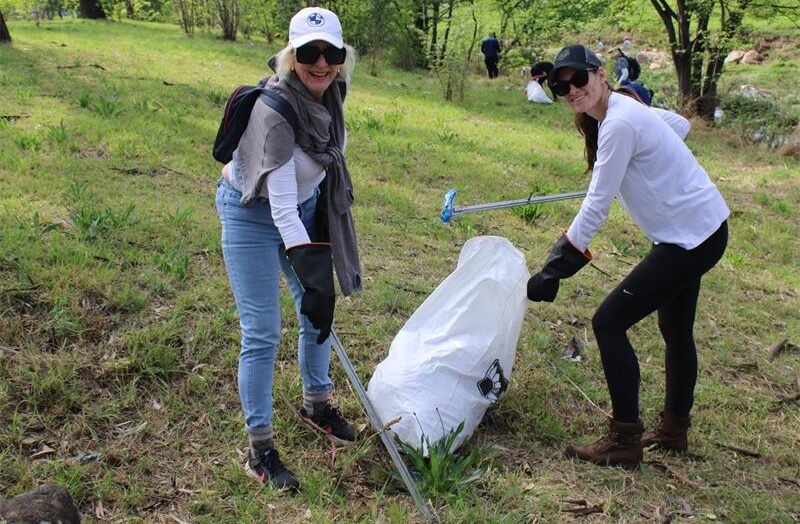 Susi Moore and Samantha McIver pick litter along the Braamfontein Spruit greenbelt on World Cleanup Day on September 20, 2026.