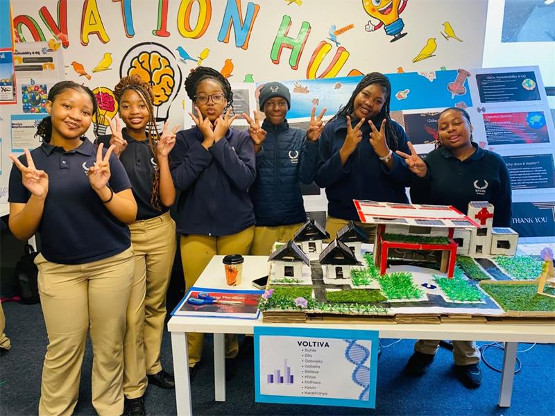 Grade 9 scholars present their project at the Impact and Nexus Internal Summit, using models and research to explore sustainable solutions on September 12, 2026.