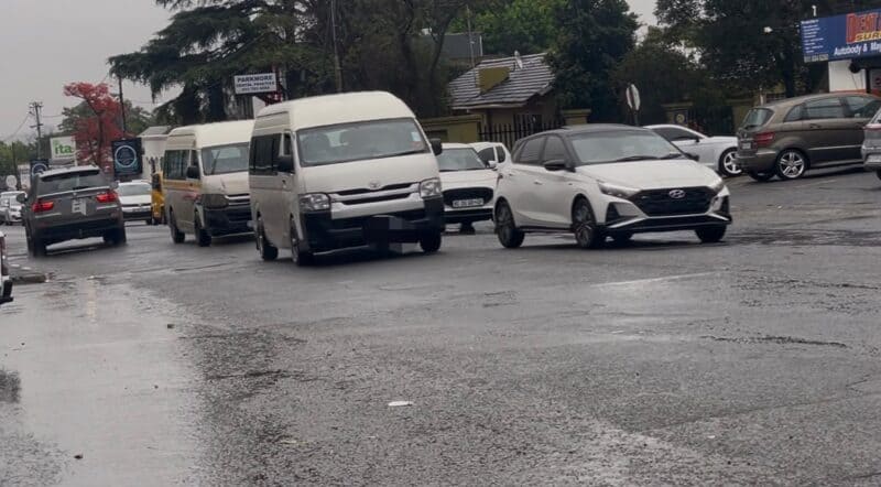 Taxis drive into the oncoming traffic lane along 11th Street in Parkmore, forcing vehicles to share the roadway on September 30, 2026.