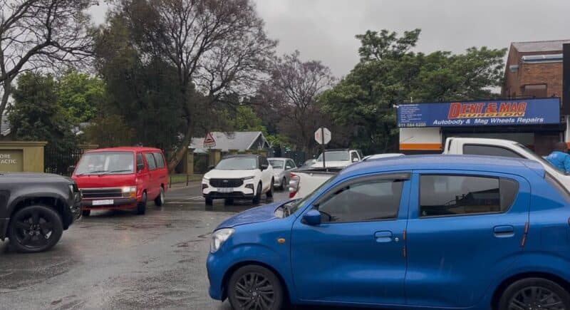Vehicles queue at the busy intersection of 11th Street and Victoria Avenue in Parkmore as motorists navigate the congested, wet roadway on September 30, 2026.