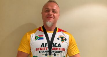 Gary Katzen shows off his medals after winning the Strict Arm Curl and Freestanding Curl titles on October 9, 2026. Photo: Duduzile Khumalo
