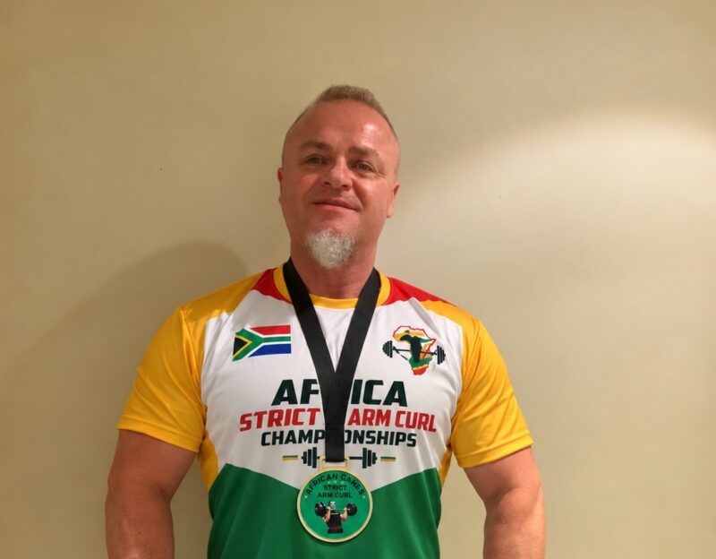 Gary Katzen shows off his medals after winning the Strict Arm Curl and Freestanding Curl titles on October 9, 2026. Photo: Duduzile Khumalo
