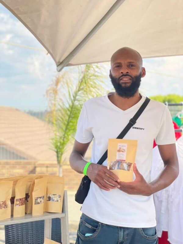 Mike Kandolo of Diaspora Foods showcases his homemade wellness products at Ward 81 Market Day in Bramley on October 10, 2026.