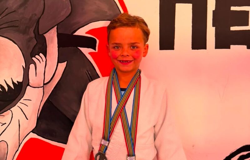 Moving up a weight category and taking on tougher opponents on the mat helped shape a young athlete's determination to succeed.