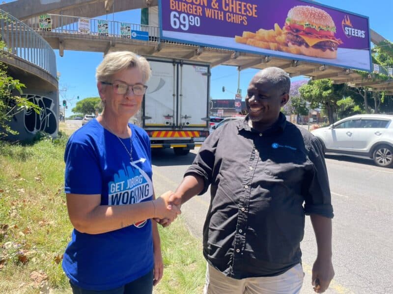 Ward 102 councillor Bea Campbell-Cloete and Kena Outdoor head of development and infrastructure Daniel Lori join forces to support the clean-up and ongoing maintenance of the Winnie Mandela Drive and Grosvenor Road pedestrian walkway in Bryanston on October 23, 2026.