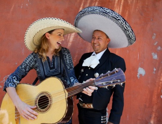 This female tourist and her bandmate are wearing sombreros from Mexico. Image by © Hugh Sitton/Corbis