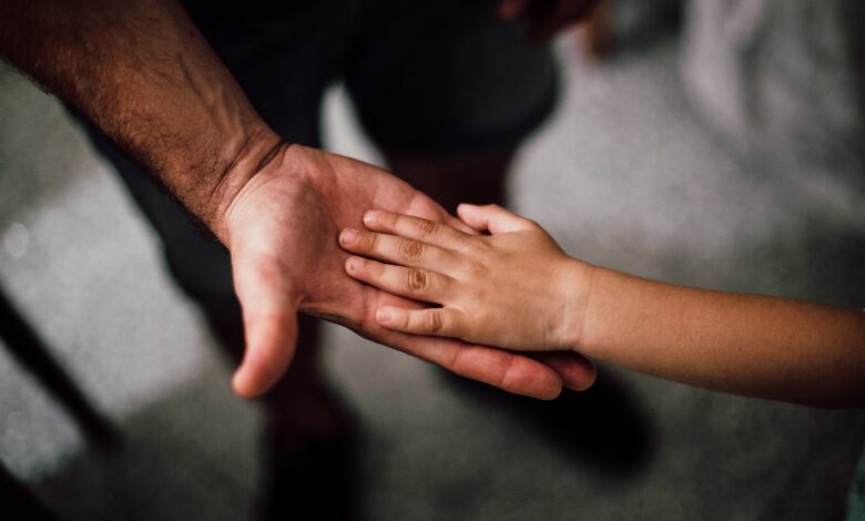 selective-focus-photography-of-child-hand-1250452