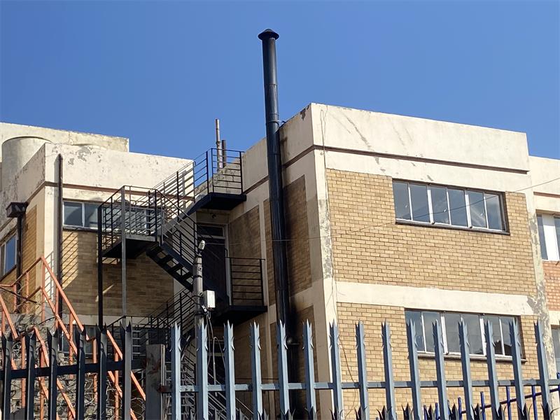 The Permanent Square building, located on Du Plessis Road in Alberton, has a chimney that emits smoke that fills the air affecting Alberton Primary School and others in the area.